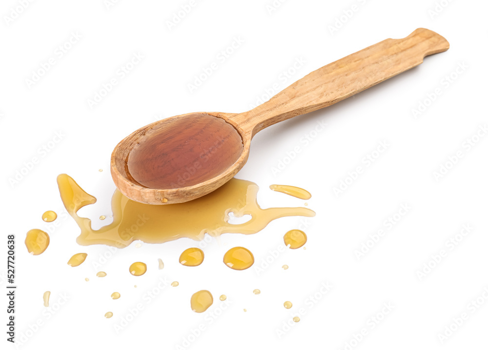 Wooden spoon with tasty maple syrup and drops on white background