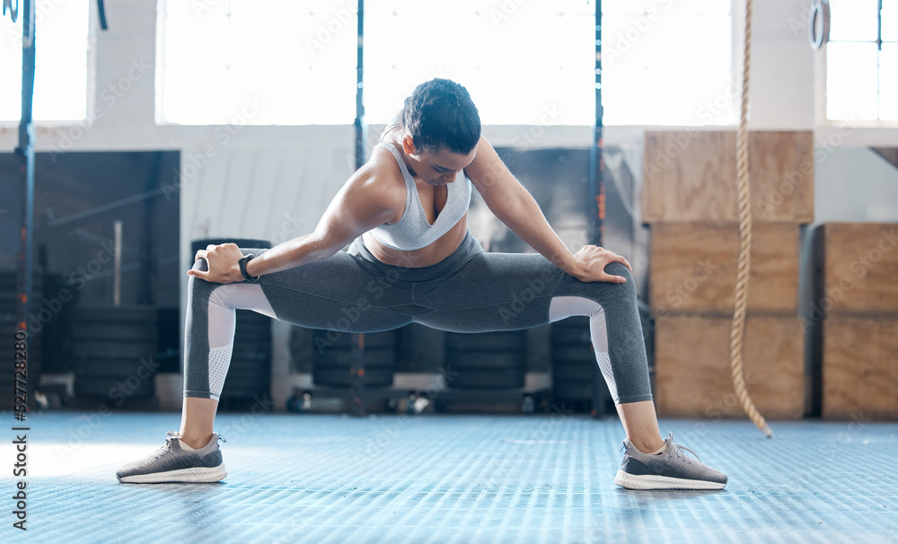 Gym, woman and stretching legs exercise before workout session training for injury prevention. Girl 