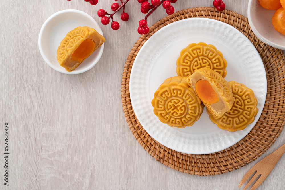 Delicious Cantonese moon cake for Mid-Autumn Festival food mooncake on wooden table background.