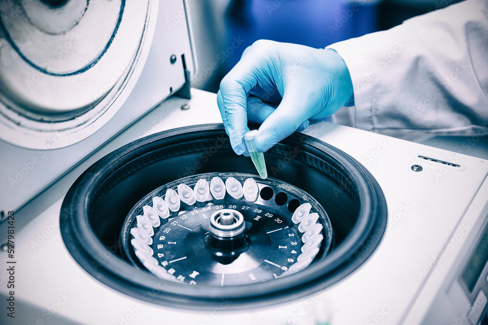 Technician experiment sample in sterilization equipment