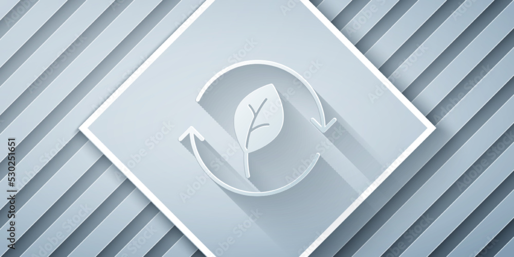 Paper cut Recycle symbol with leaf icon isolated on grey background. Circular arrow icon. Environmen