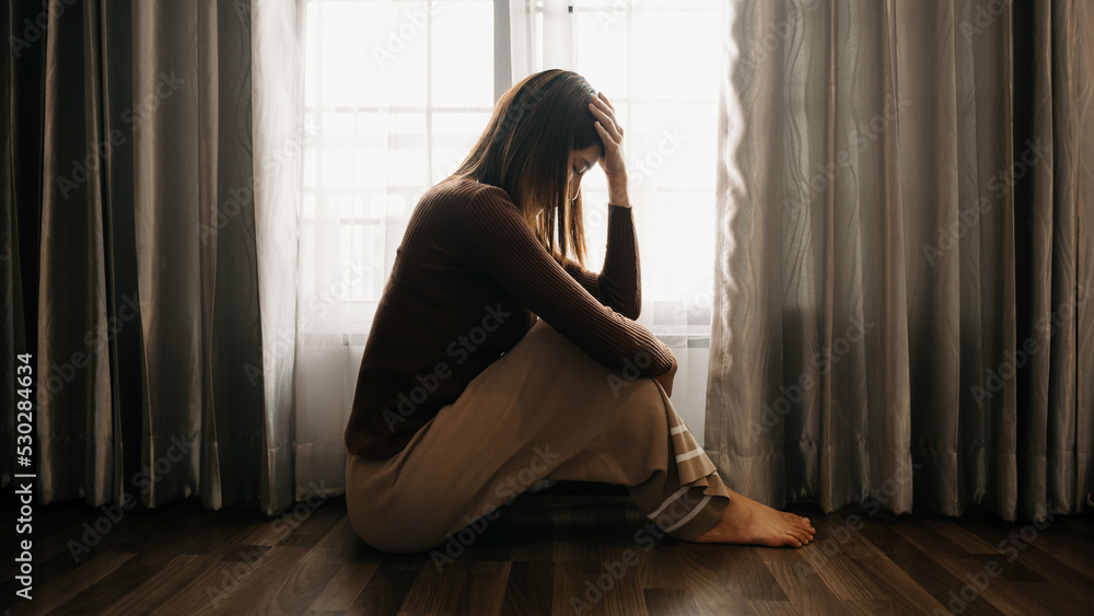 woman sit Depression Standing by window and anxiety Copy space. ..