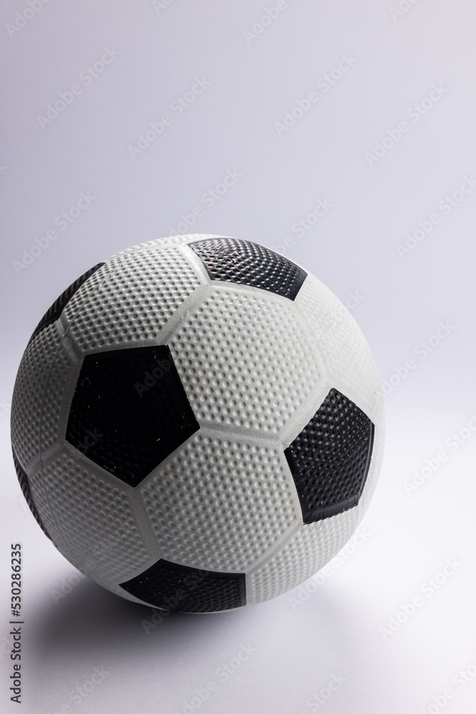 Composition of football on white background with copy space