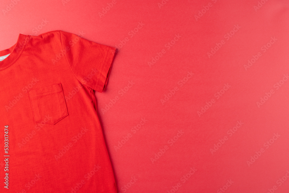 Image of red tshirt lying on red surface