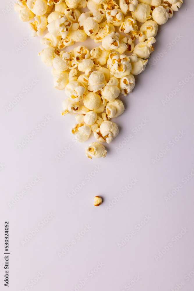 Vertical image of pop corn on white background