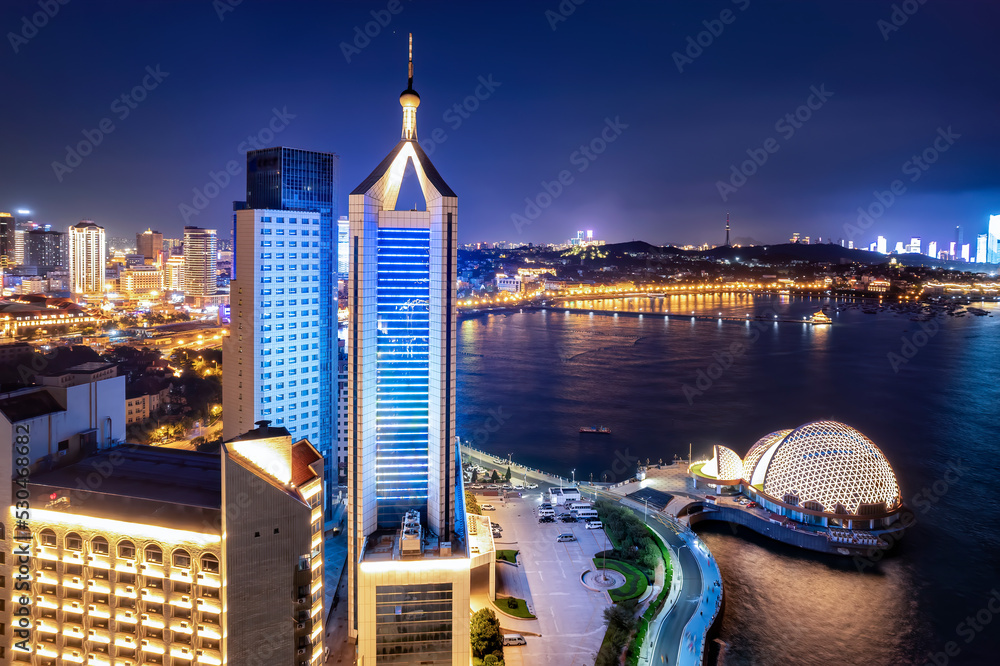 Aerial photography night view of modern city buildings in Qingdao, China