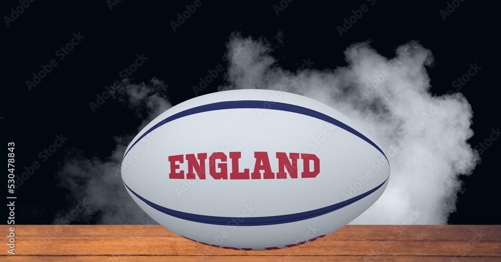 Composition of rugby ball decorated with text england on black background with smoke