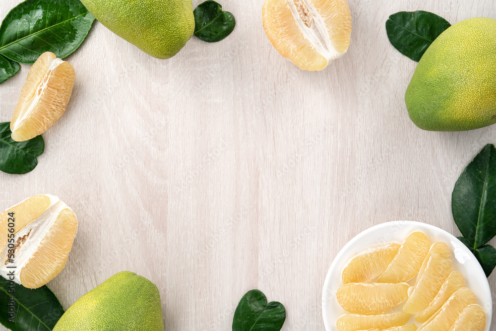 Fresh pomelo fruit on white table background.