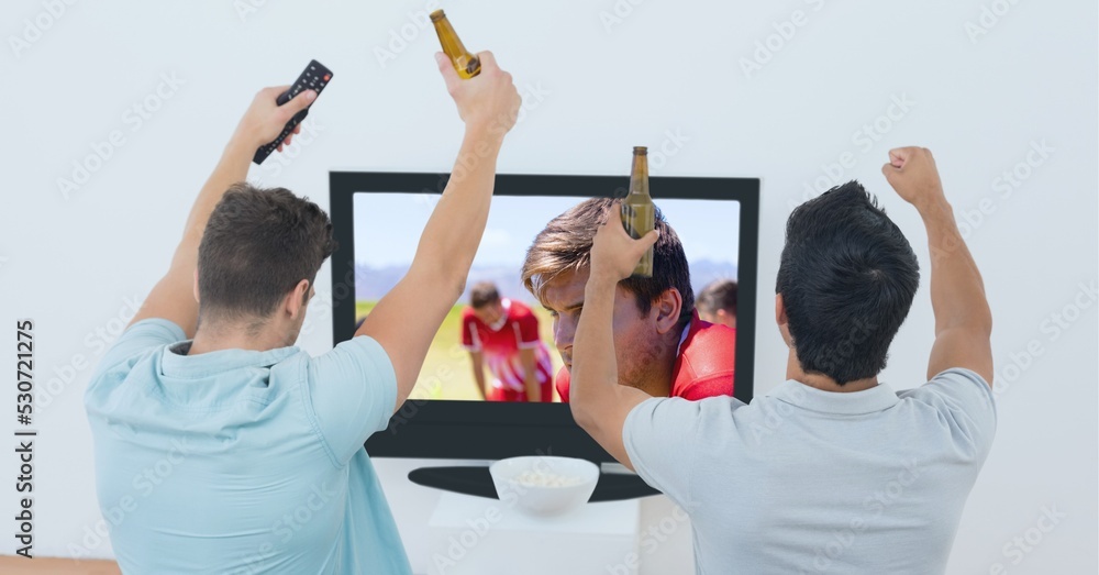 Composition of two male sports fans watching football match on tv