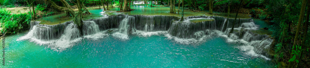 beautiful water fall and Leaf natural leaves and stream green forest in the  mountain concept back g