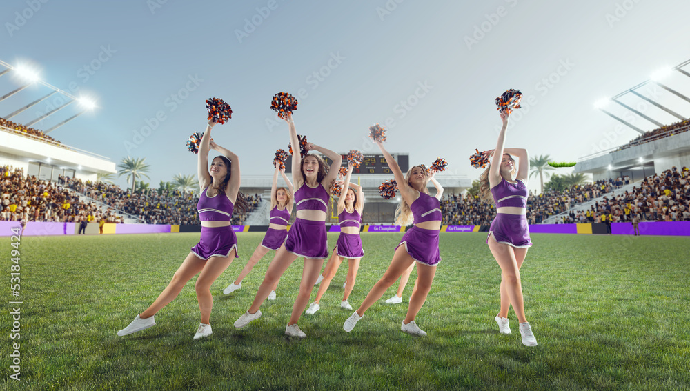 Group of cheerleaders in action on  stadium