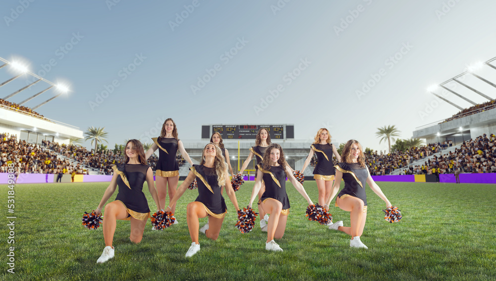 Group of cheerleaders in action on  stadium