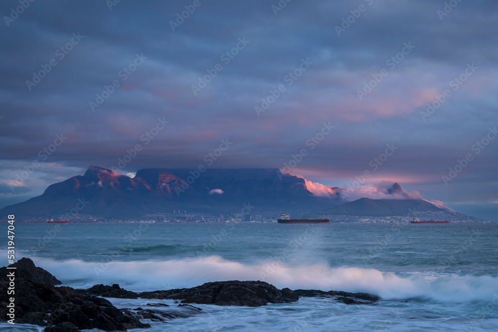 View of Table Mountain at dusk from Bloubergstrand, Cape Town. Western Cape. South Africa. 