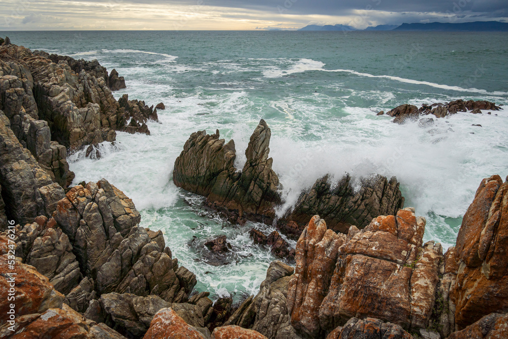 The rocky coastline of Walker Bay at De Kelders near Gansbaai in the Overberg, Western Cape. South A