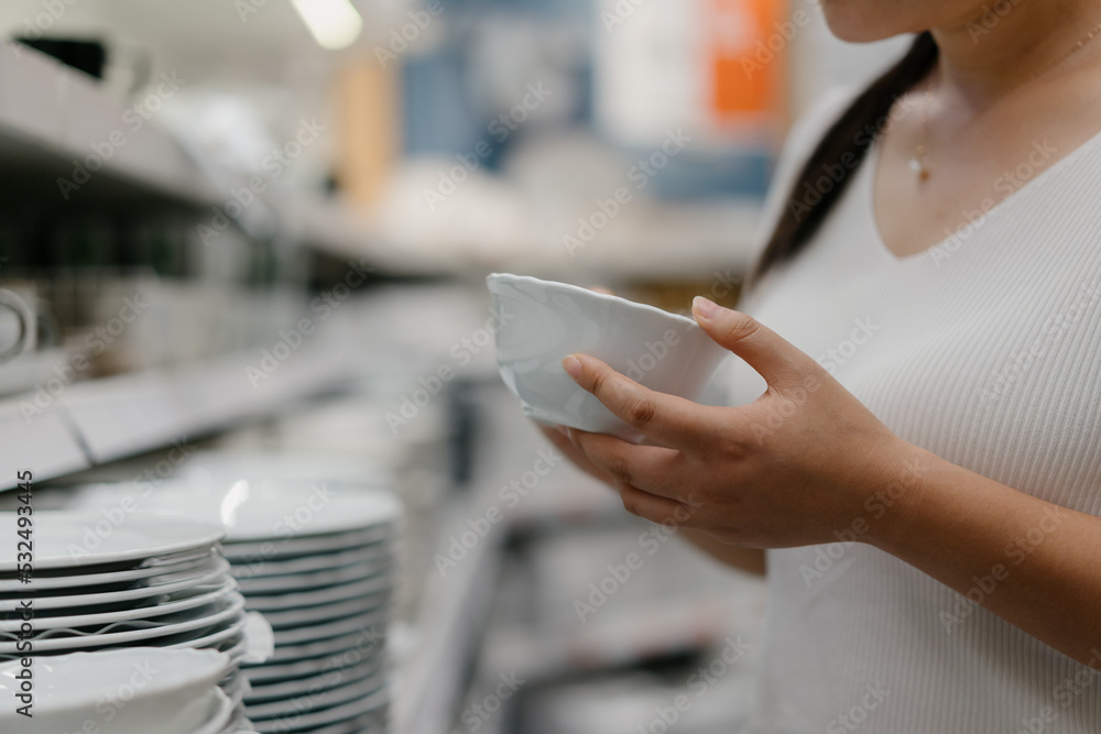 woman buying cutlery in mall