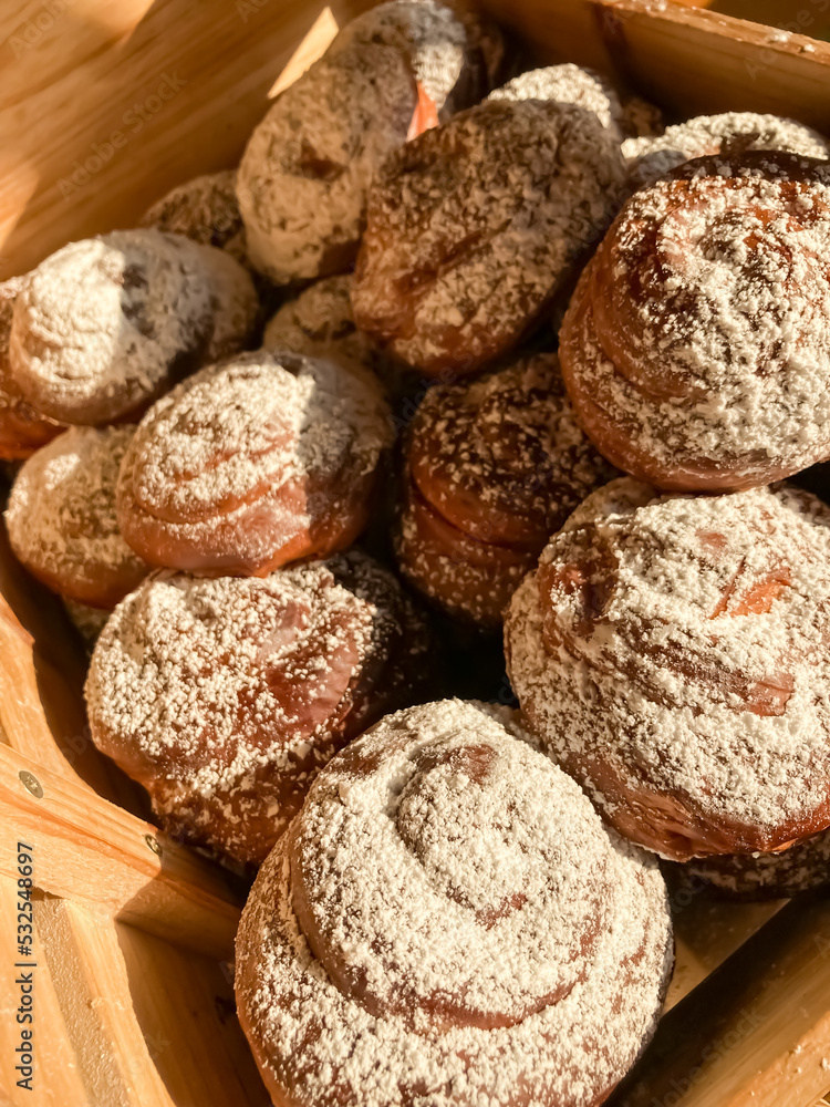 Fresh pastries in a wooden box. 