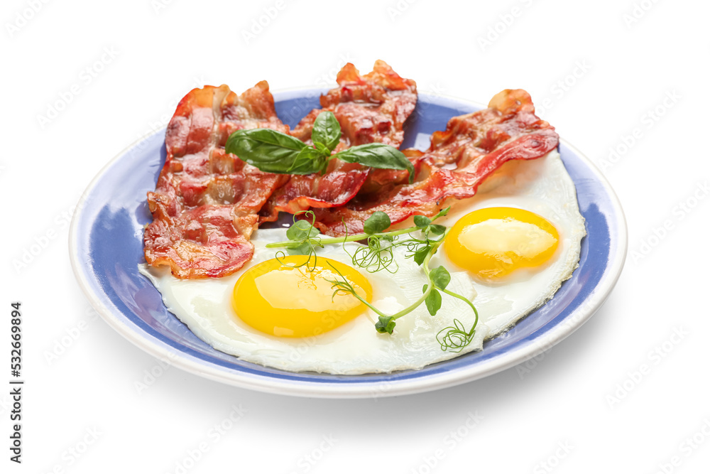 Plate of tasty fried eggs with bacon on white background