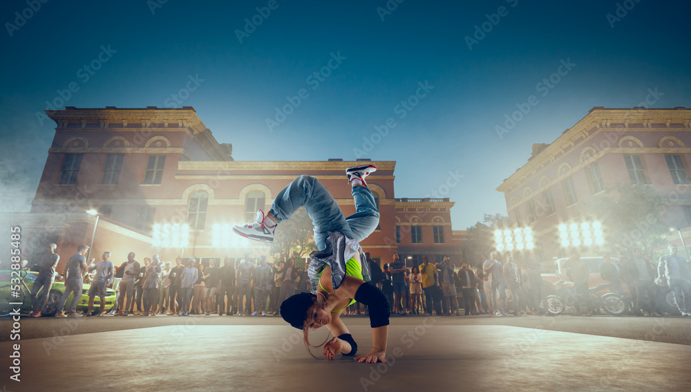 Street dancer girl  dance breakdance on evening street