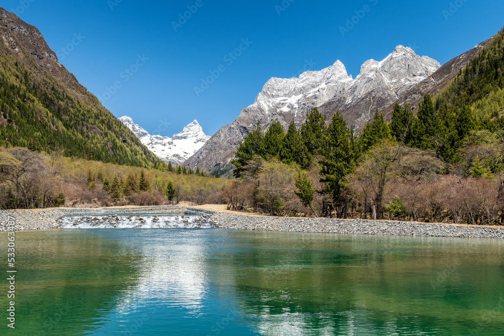 The lake and snow mountains in Four Girls Mountain scenic spot Chengdu city Sichuan province, China.