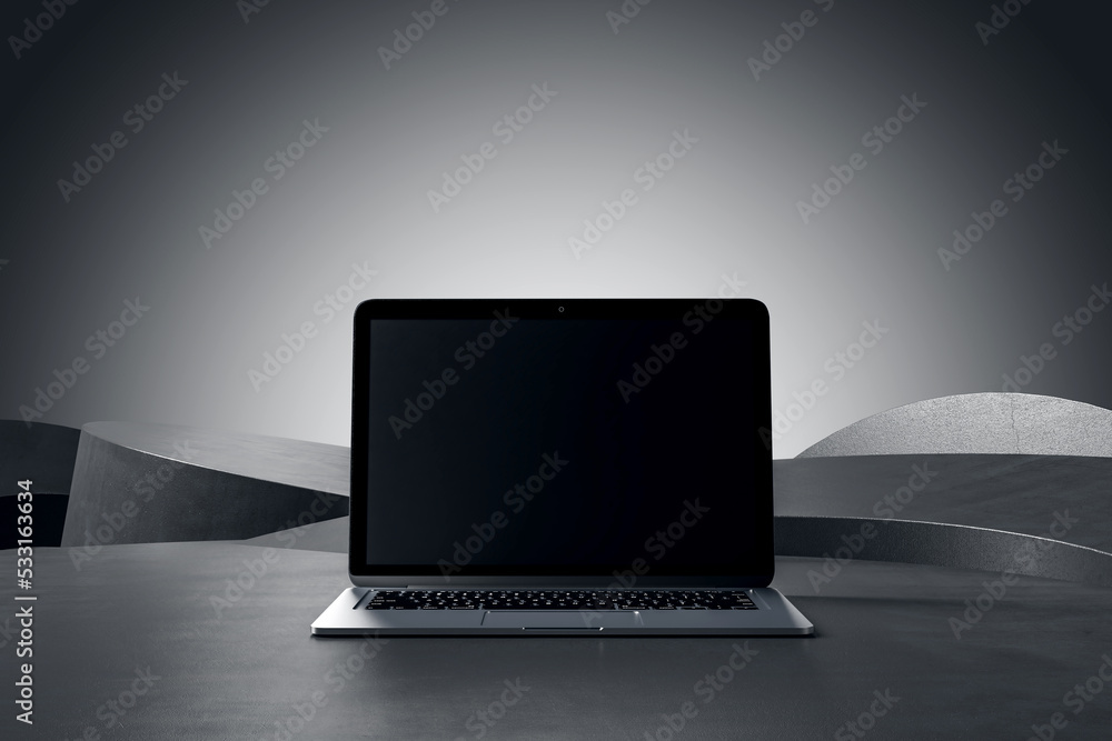 Front view on blank black modern laptop screen with space for your logo or text on abstract concrete