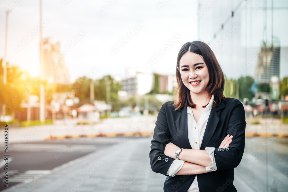 Portrait of Asian business woman smiling and embrace outdoor of her office or airport