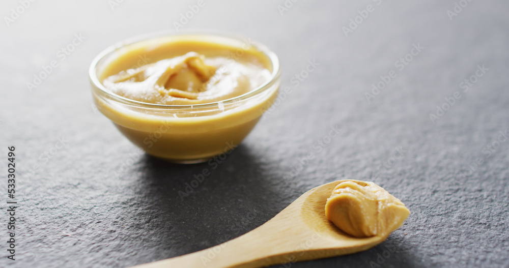 Image of close up of peanut butter on gray background