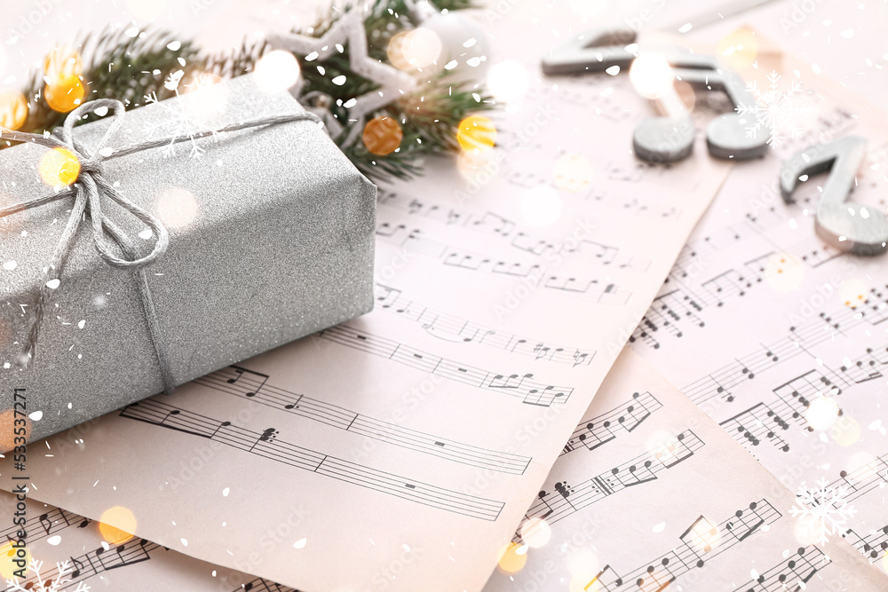 Note sheets, gift and Christmas decor on table, closeup