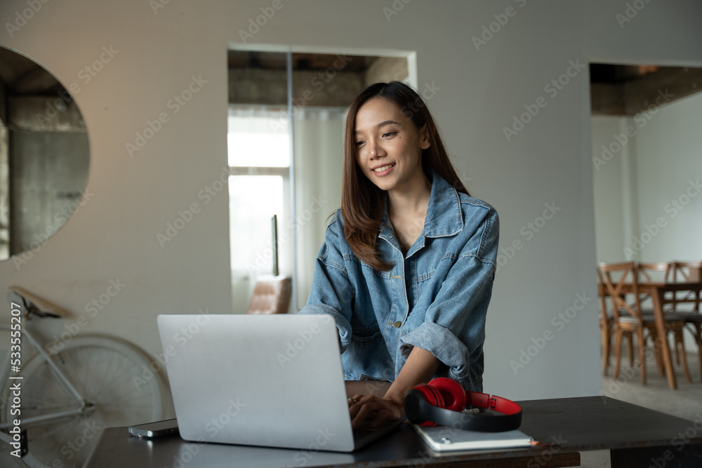 Beautiful young woman working using computer laptop.