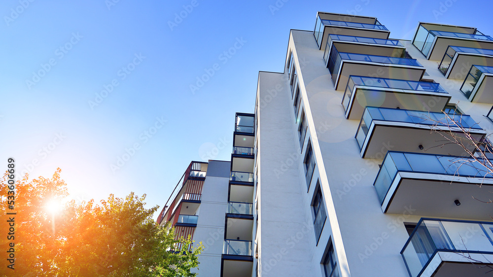 Modern residential building with new apartments in a green residential area. Eco architecture. Green