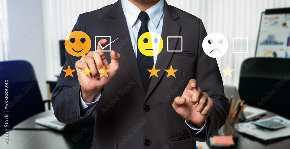 Customer service evaluation concept. Businessman pressing face smile emoticon show on virtual screen