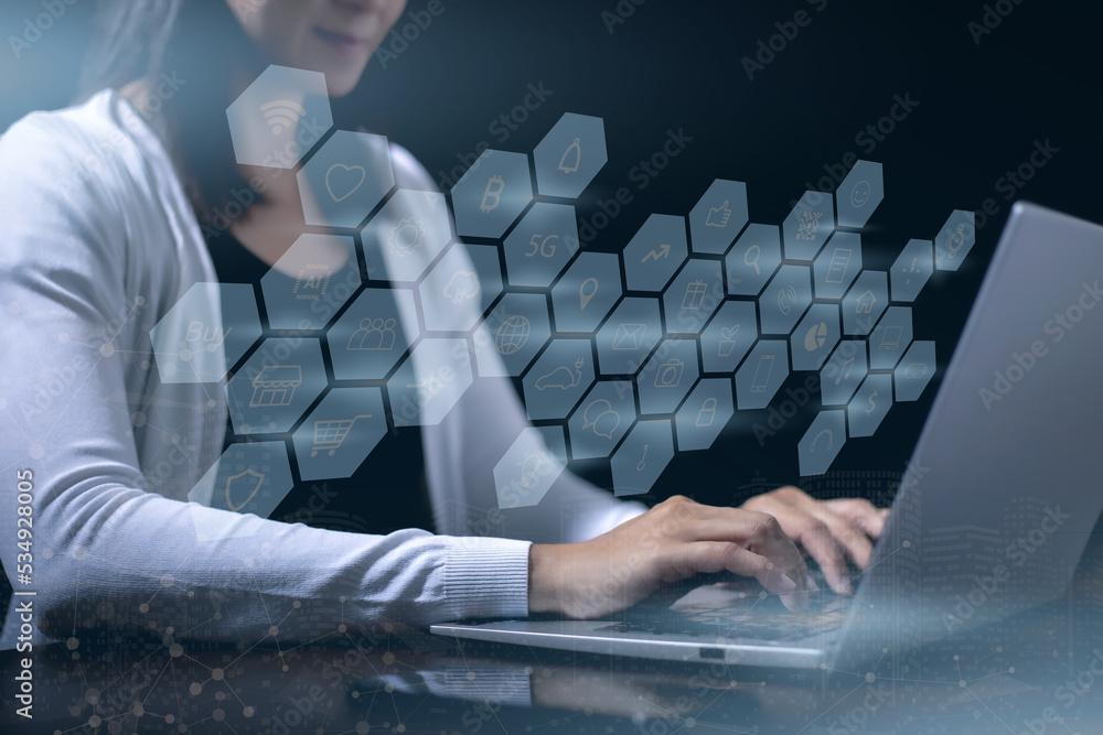 Close up of hand woman using computer notebook on dark background. Internet connection technology re