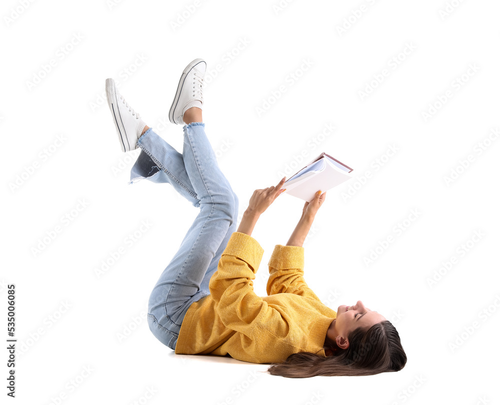 Beautiful woman in yellow sweater reading book on white background