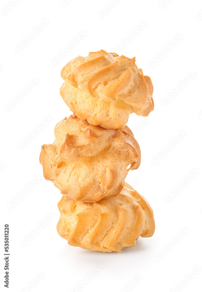 Tasty round eclairs on white background