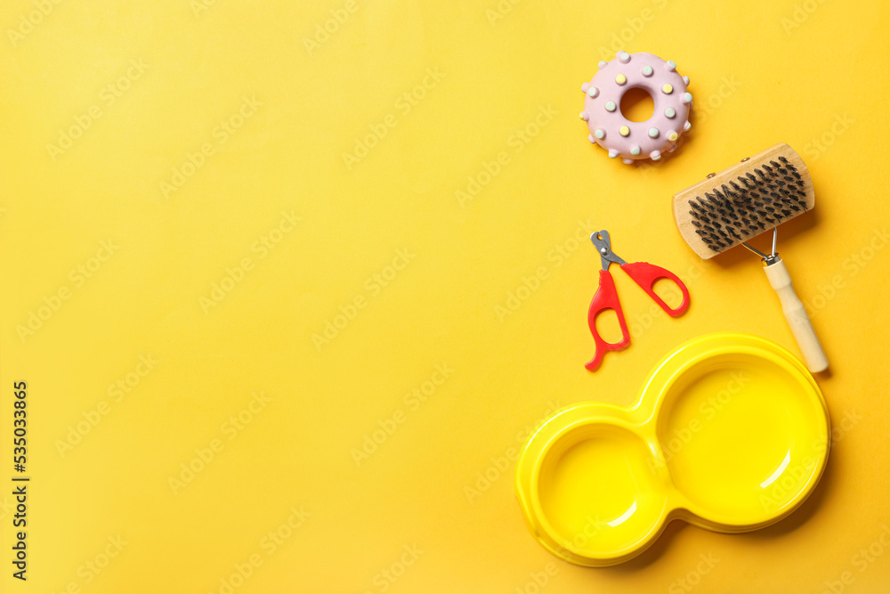 Pet care accessories on yellow background