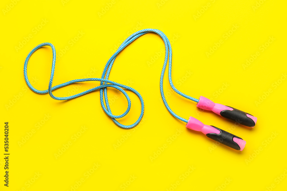 Skipping rope on yellow background