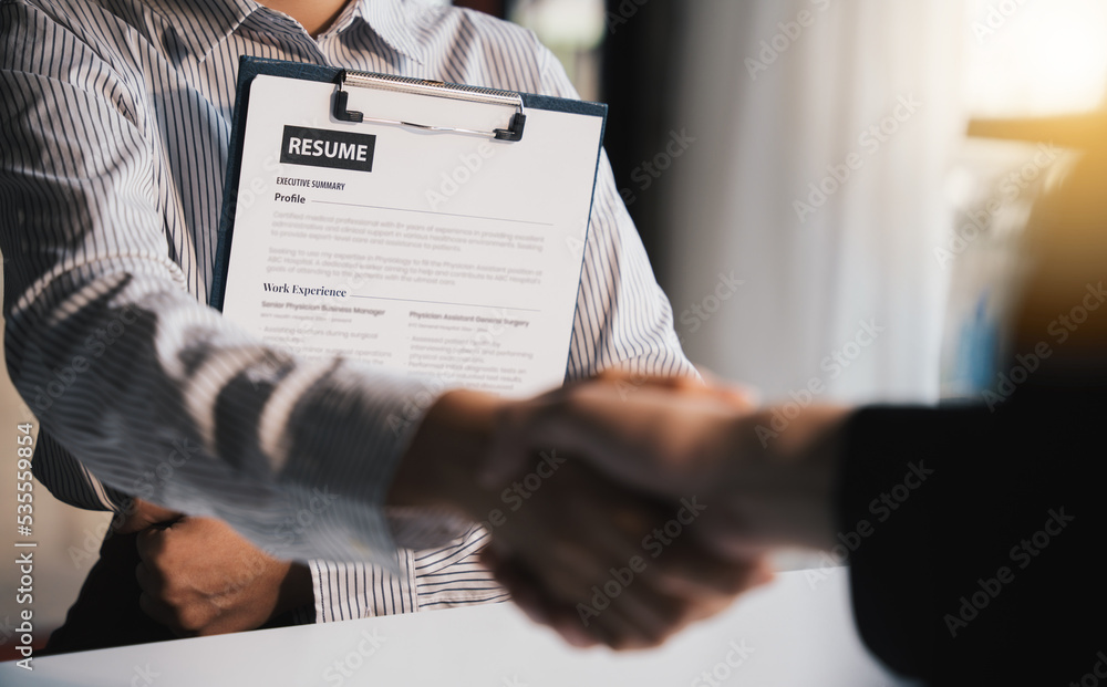 Businesswoman Holding Resume,Examiner reading a resume during job interview at office Business and h