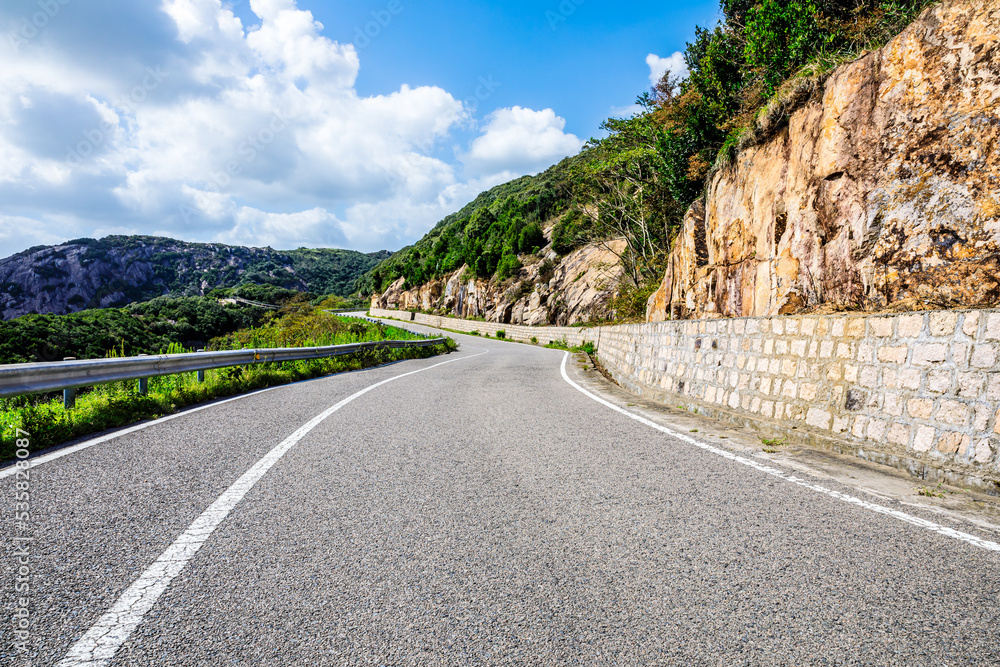 Asphalt road and mountain natural scenery background