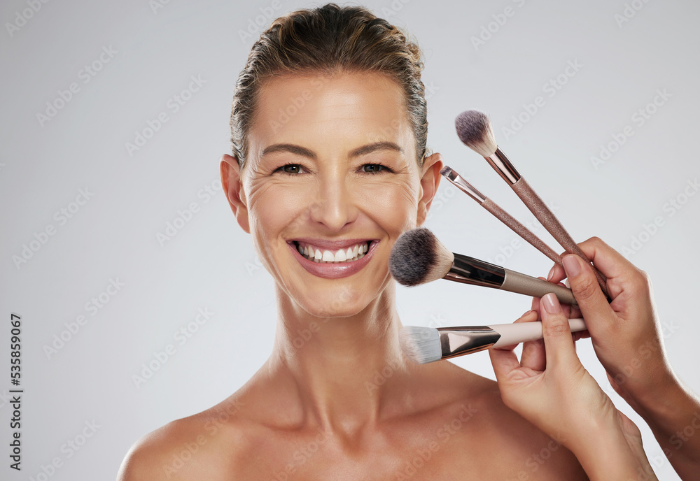 Beauty, makeup and cosmetic brush by a senior woman face with a happy smile in a studio. Portrait of