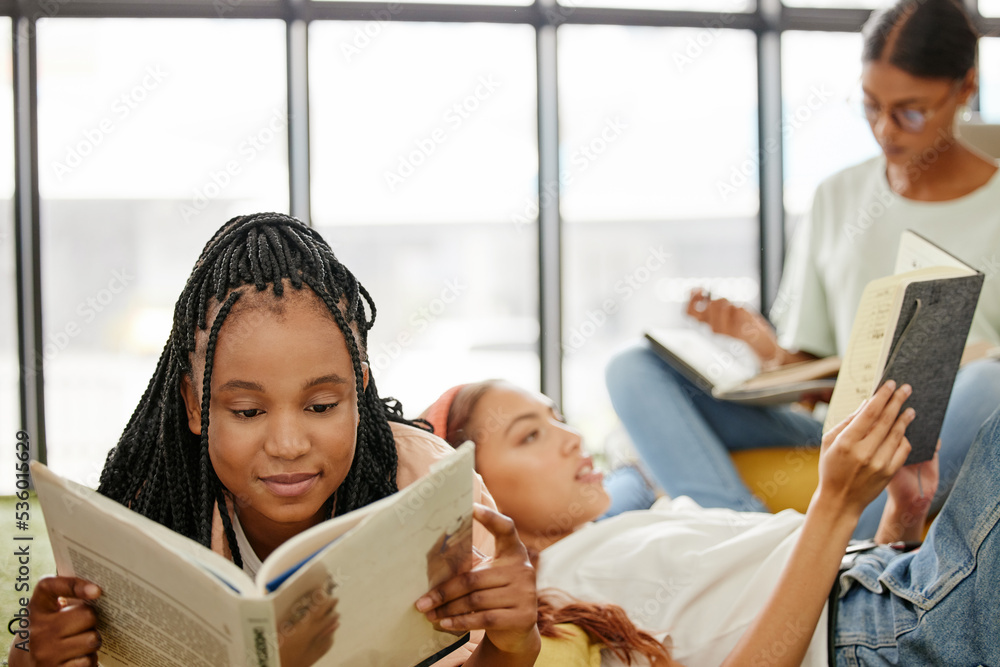 Students, books and library in college to reading, relax and learning for girl friends. Education, s