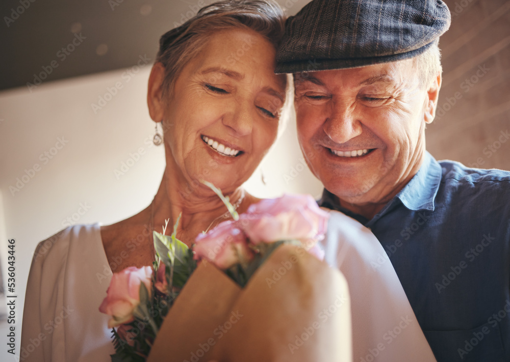 Love, hug and old couple with flowers as a gift in celebration of a happy birthday, marriage and val