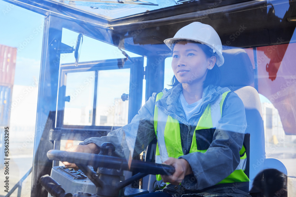 Supply chain, logistics and transport with a woman shipping worker driving a vehicle on a commercial