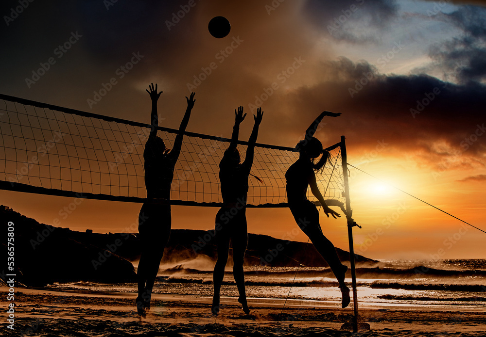 Sports, beach and volleyball at sunset by women silhouette jumping for ball together, fun, travel an