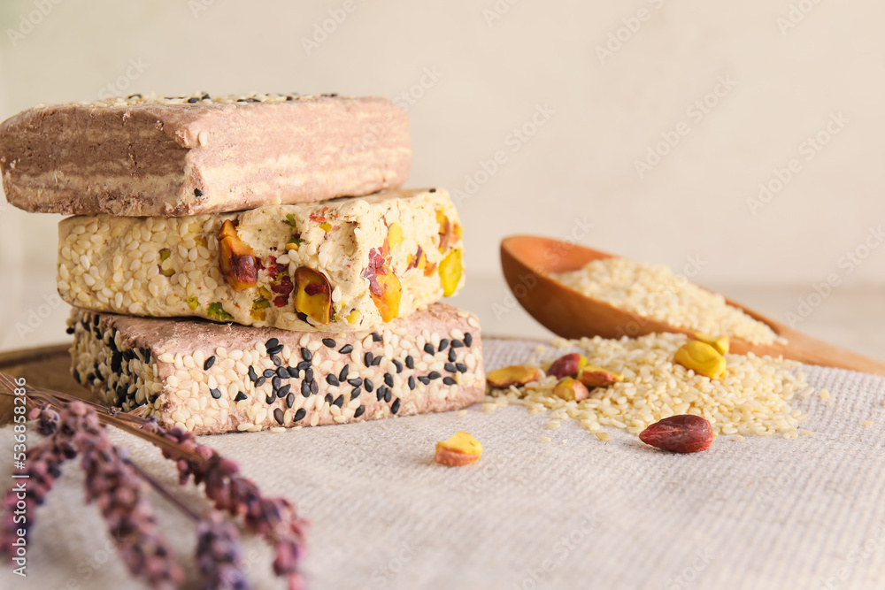 Delicious sesame halva on light table, closeup