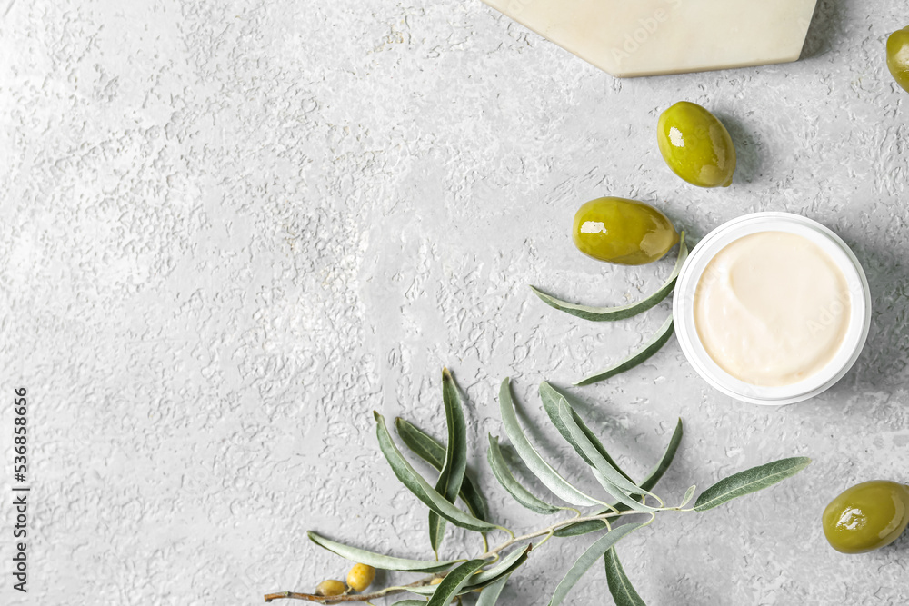 Jar of natural olive cream on light background