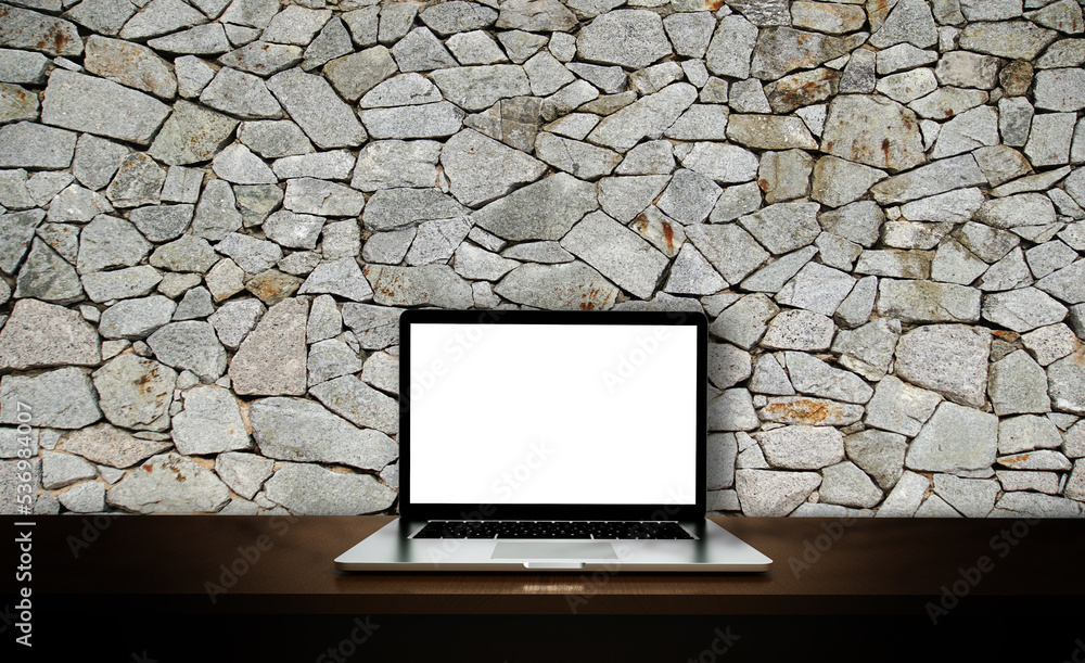 Modern laptop  isolated on rock background. 3D illustration.