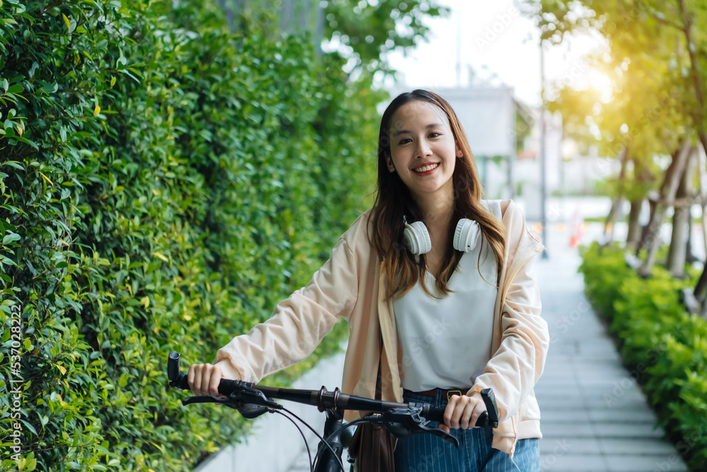 Beautiful Asian woman listening favourite music on headphones from mobile phone, Happiness relaxatio