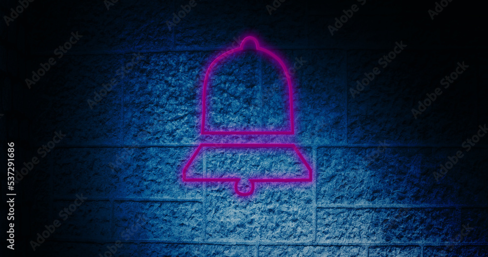 Composite of illuminated digital pink notification bell icon against blue wall, copy space