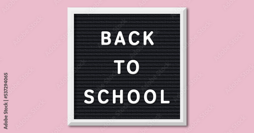 Image of back to school on board over pink background