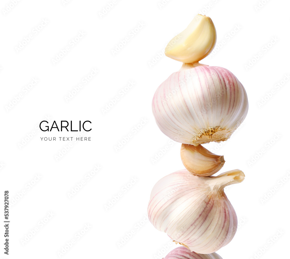 Creative layout made of garlic on the white background. Flat lay. Food concept. Macro concept. 