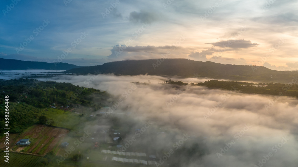 Mountains in fog at beautiful autumn in Phetchabun Thailand. Fog mountain valley, low clouds, forest